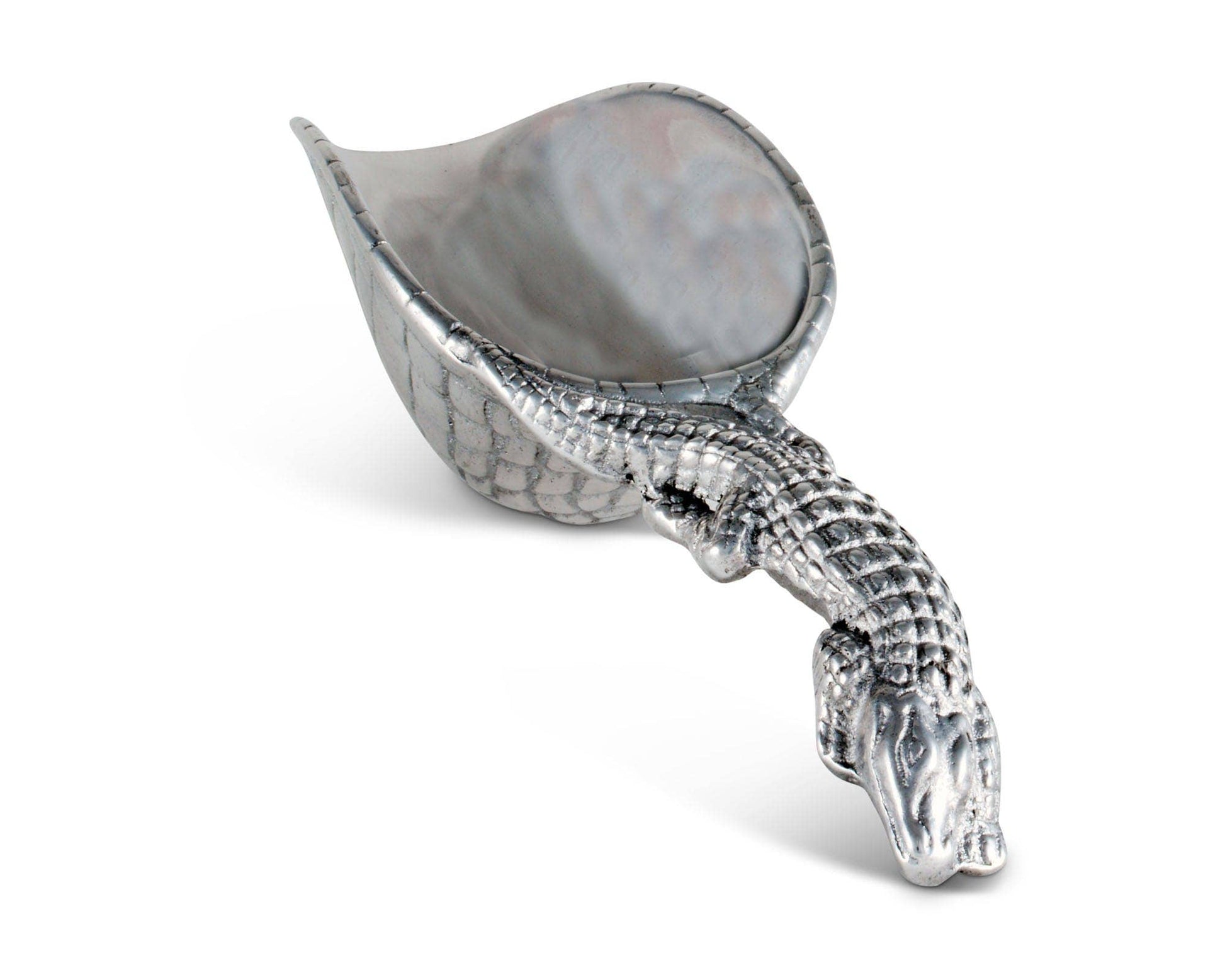 The alligator motif of this practical ice scoop is signature of Arthur Court Designs. Measuring 8 inches in length, the ice scoop is created in sand-cast aluminum. Functional and decorative, it makes serving drinks easy for the fastidious host or hostess. The handle is long enough to insure a firm grip. An alligator offers its ribbed, scaly body as the handle, infusing into the bowl as its tail continues to wind around the right edge. The bottom of the handmade, aluminum scoop mirrors the scaly pattern of t