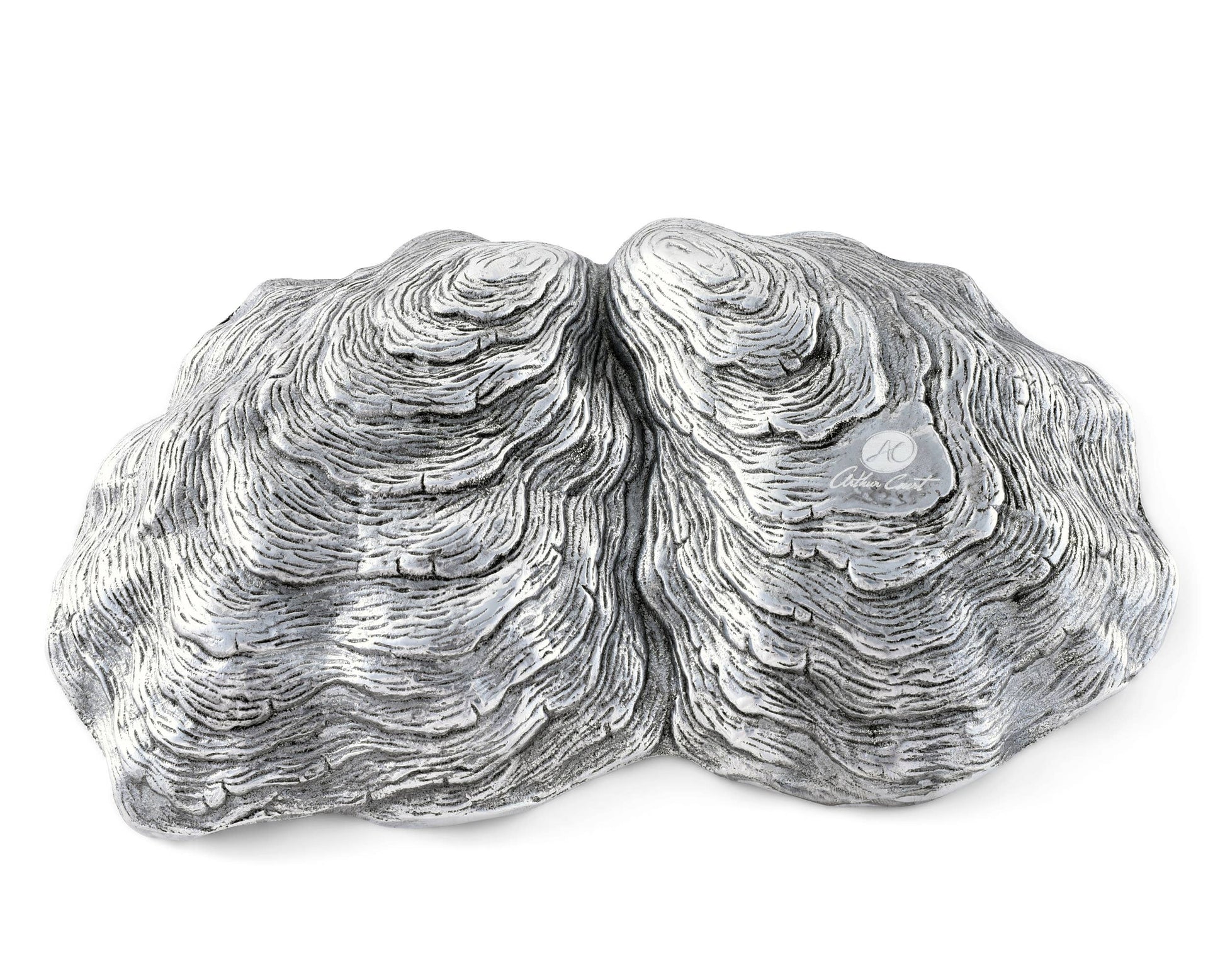 Arthur Court's sand-cast aluminum alloy is the perfect material for this Oyster shaped Catch-All Tray. The shiny luster of the tray mimics the inside of a real oyster to reflect the pretty objects you display on the tray or enhance the little treat tidbit As unique as the shell fish that inspired it's design, our Oyster Catch-All Tray is hand-crafted in Arthur Court's signature aluminum alloy. The design of an open oyster shell has plenty of room to hold glasses, keys or jewelry wherever you decide to displ