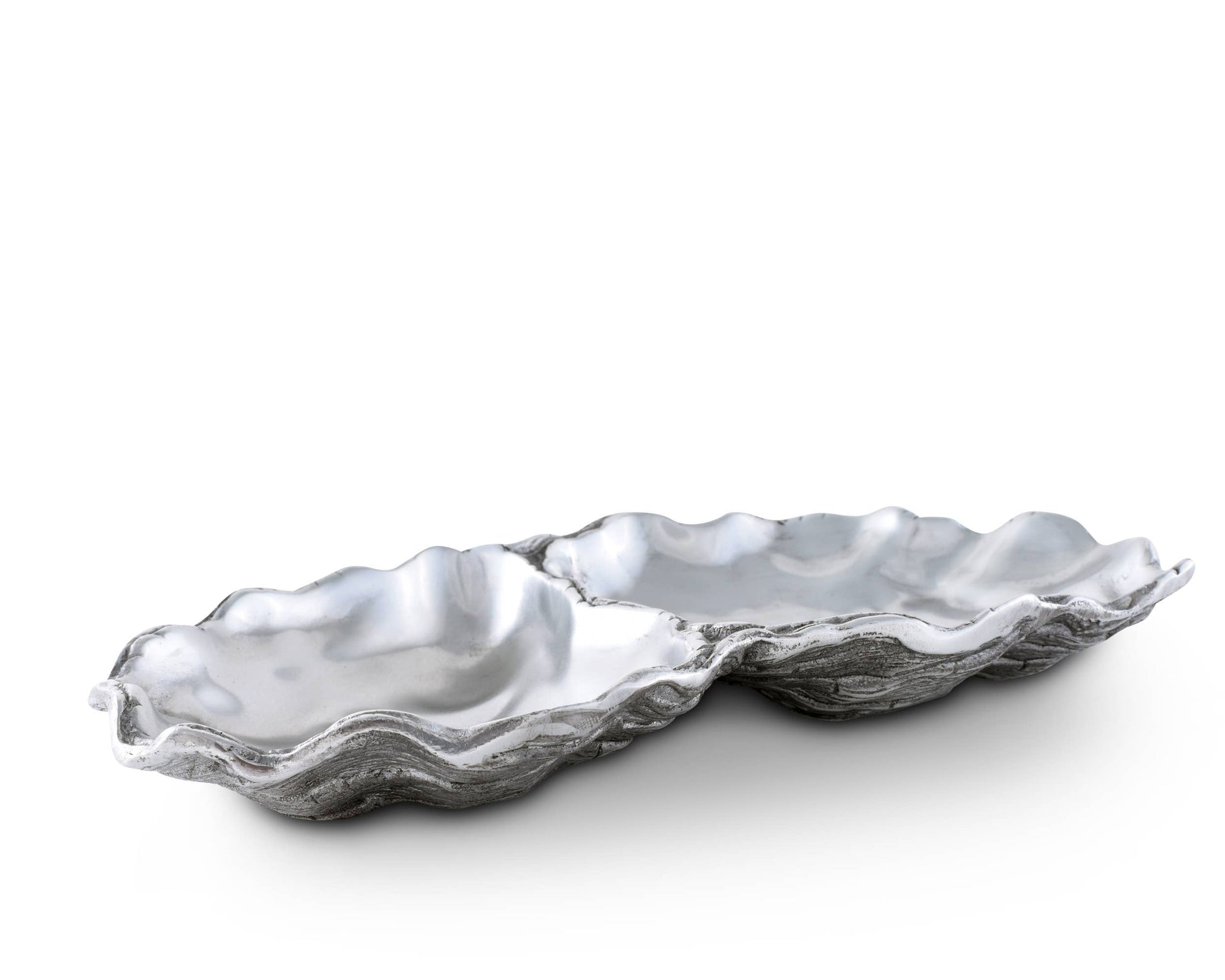 Arthur Court's sand-cast aluminum alloy is the perfect material for this Oyster shaped Catch-All Tray. The shiny luster of the tray mimics the inside of a real oyster to reflect the pretty objects you display on the tray or enhance the little treat tidbit As unique as the shell fish that inspired it's design, our Oyster Catch-All Tray is hand-crafted in Arthur Court's signature aluminum alloy. The design of an open oyster shell has plenty of room to hold glasses, keys or jewelry wherever you decide to displ