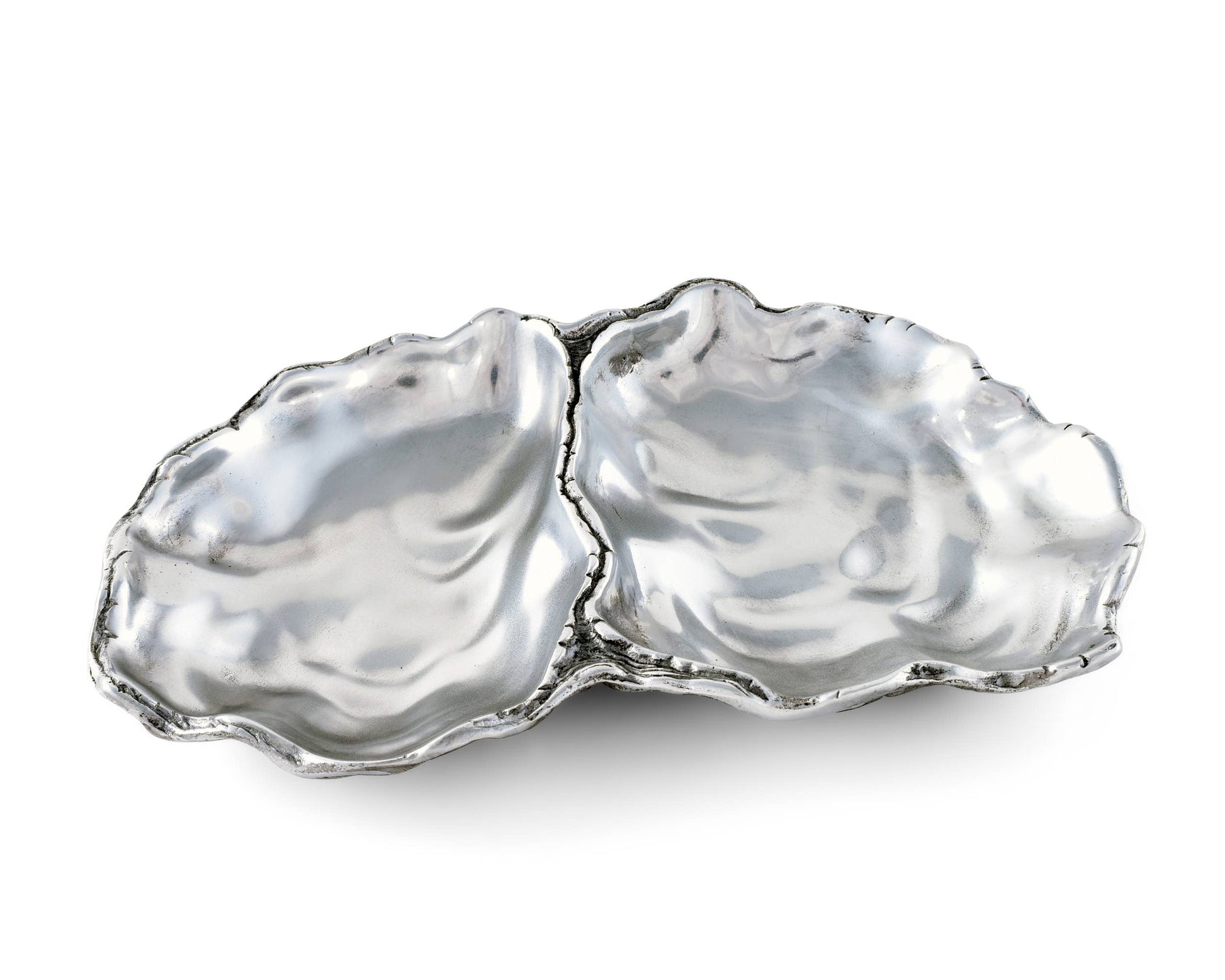 Arthur Court's sand-cast aluminum alloy is the perfect material for this Oyster shaped Catch-All Tray. The shiny luster of the tray mimics the inside of a real oyster to reflect the pretty objects you display on the tray or enhance the little treat tidbit As unique as the shell fish that inspired it's design, our Oyster Catch-All Tray is hand-crafted in Arthur Court's signature aluminum alloy. The design of an open oyster shell has plenty of room to hold glasses, keys or jewelry wherever you decide to displ