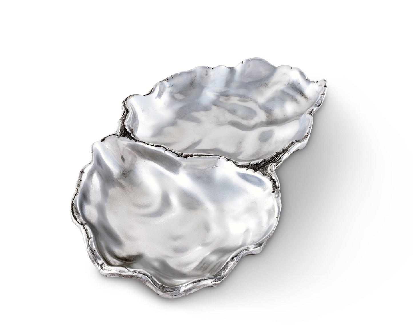 Arthur Court's sand-cast aluminum alloy is the perfect material for this Oyster shaped Catch-All Tray. The shiny luster of the tray mimics the inside of a real oyster to reflect the pretty objects you display on the tray or enhance the little treat tidbit As unique as the shell fish that inspired it's design, our Oyster Catch-All Tray is hand-crafted in Arthur Court's signature aluminum alloy. The design of an open oyster shell has plenty of room to hold glasses, keys or jewelry wherever you decide to displ