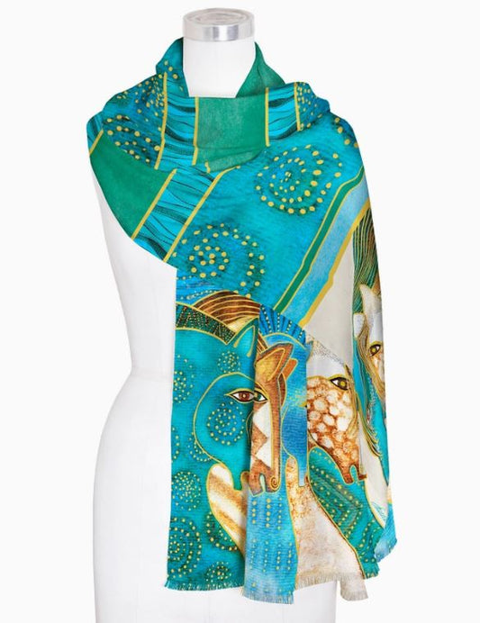 This Fine Art Silk Blend Shawl, called the Sky Mares, is a colorful, cozy and stylish accessory that can be worn as a wrap or scarf. Each piece is inspired by a museum artwork, staying true to its original design and colors. Enjoy the soft, draping feel of the fine silk fabric and its reversible print which complements a solid color. Versatile in use, this shawl can be hand washed and hung to dry. Measuring at 28” x 78” (71 cm x 198 cm), the Sky Mares shawl is a true work of art.