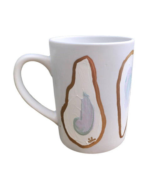 This Hand Painted Oyster Coffee Mug is the perfect quirky addition to your mug collection. Lovingly hand painted by Sam Lanier in Madisonville, Louisiana, each mug boasts 4 unique and playful oysters adorned with gold trim. Standing 4 1/2 inches tall and holding 14 oz, this mug is sure to bring a touch of humor to your daily coffee routine.