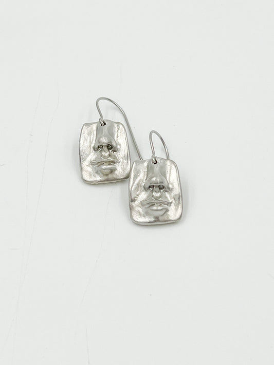 Check out these quirky Face Earrings - they have a matte finish and are made with surgical steel, so they're 100% lead and nickel free. Measuring at 3/4", they're the perfect addition to any outfit.