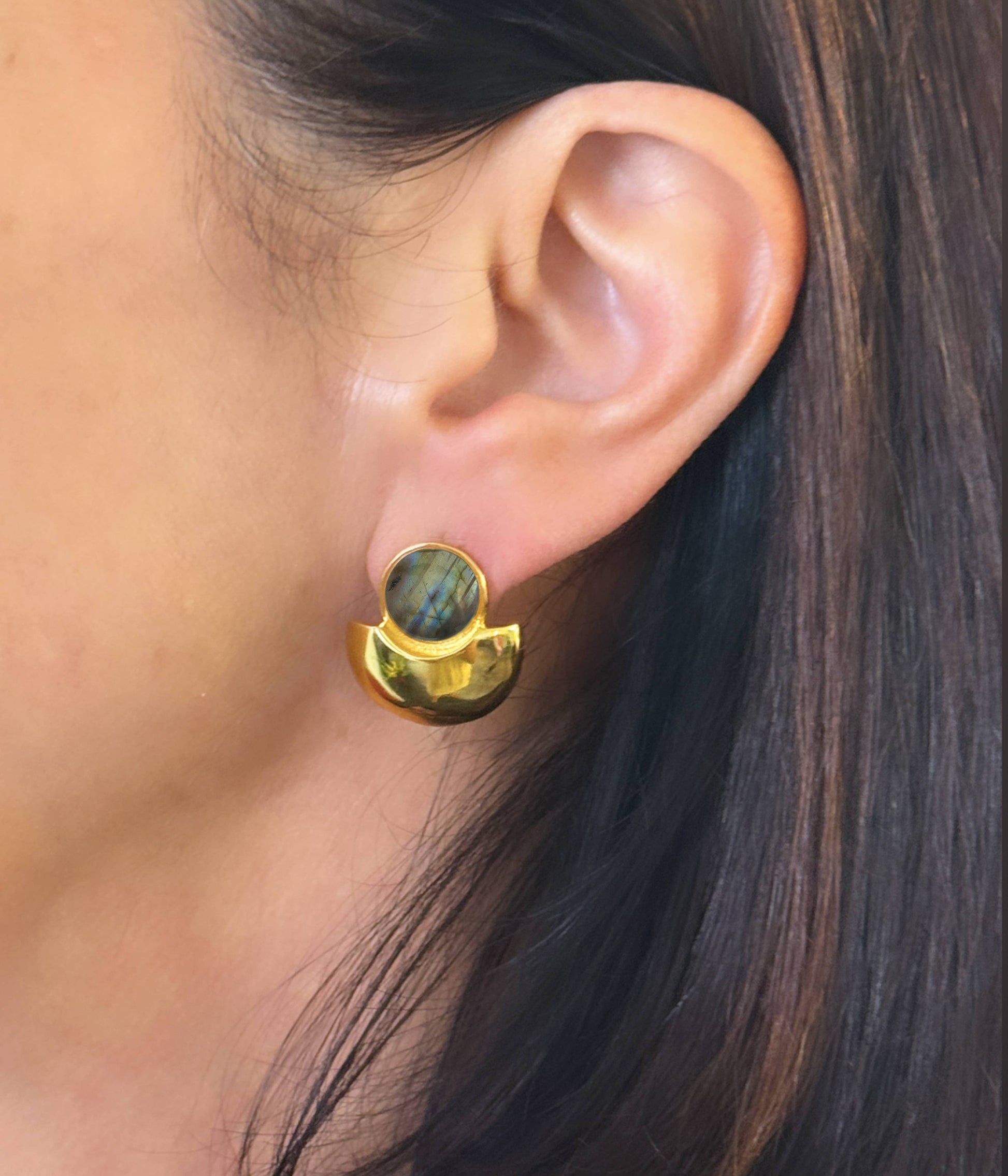 Swanky + sleek The Details Sculpted, modern post earring 2/3” x 2/3” 10mm round cabochon detail Polished 14 karat gold over brass Surgical steel post with large hypoallergenic silicone back