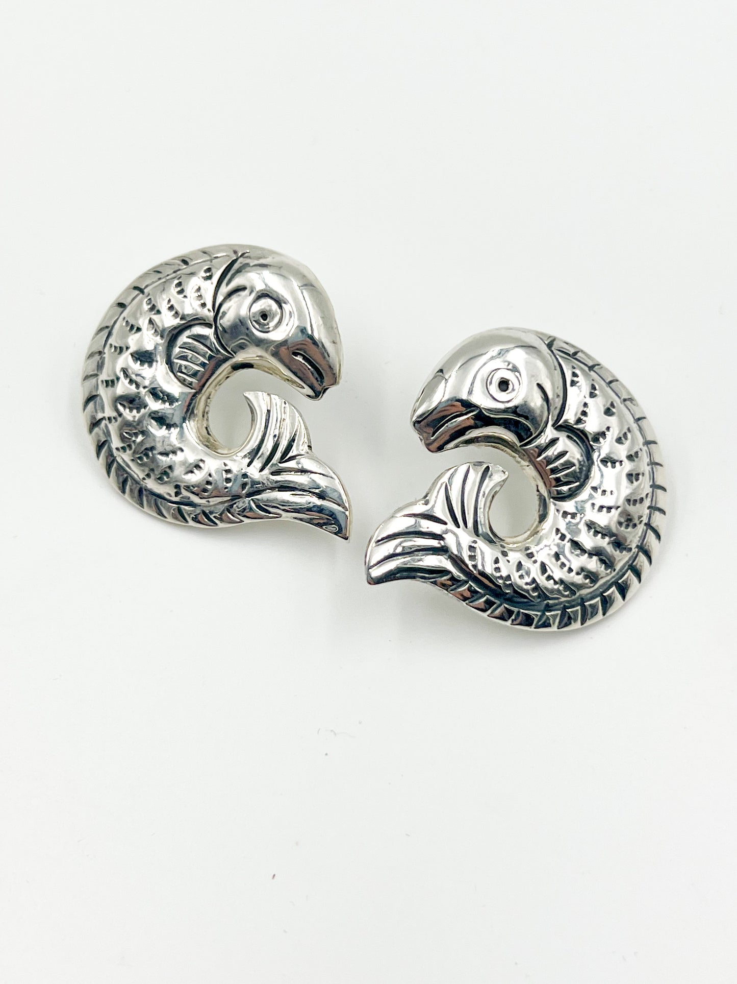 Looking for a fun, quirky earring to add to your collection? Check out the Spratling Silver Fish Clip Earring! Designed with a unique clip clip design, these earrings are one-of-a-kind. Each piece is handmade and carries the current Mexican registry mark TS-24, along with a replica of an older Spratling hallmark. Keep in mind, due to the handmade nature of these earrings, sizes may vary slightly from the photo.