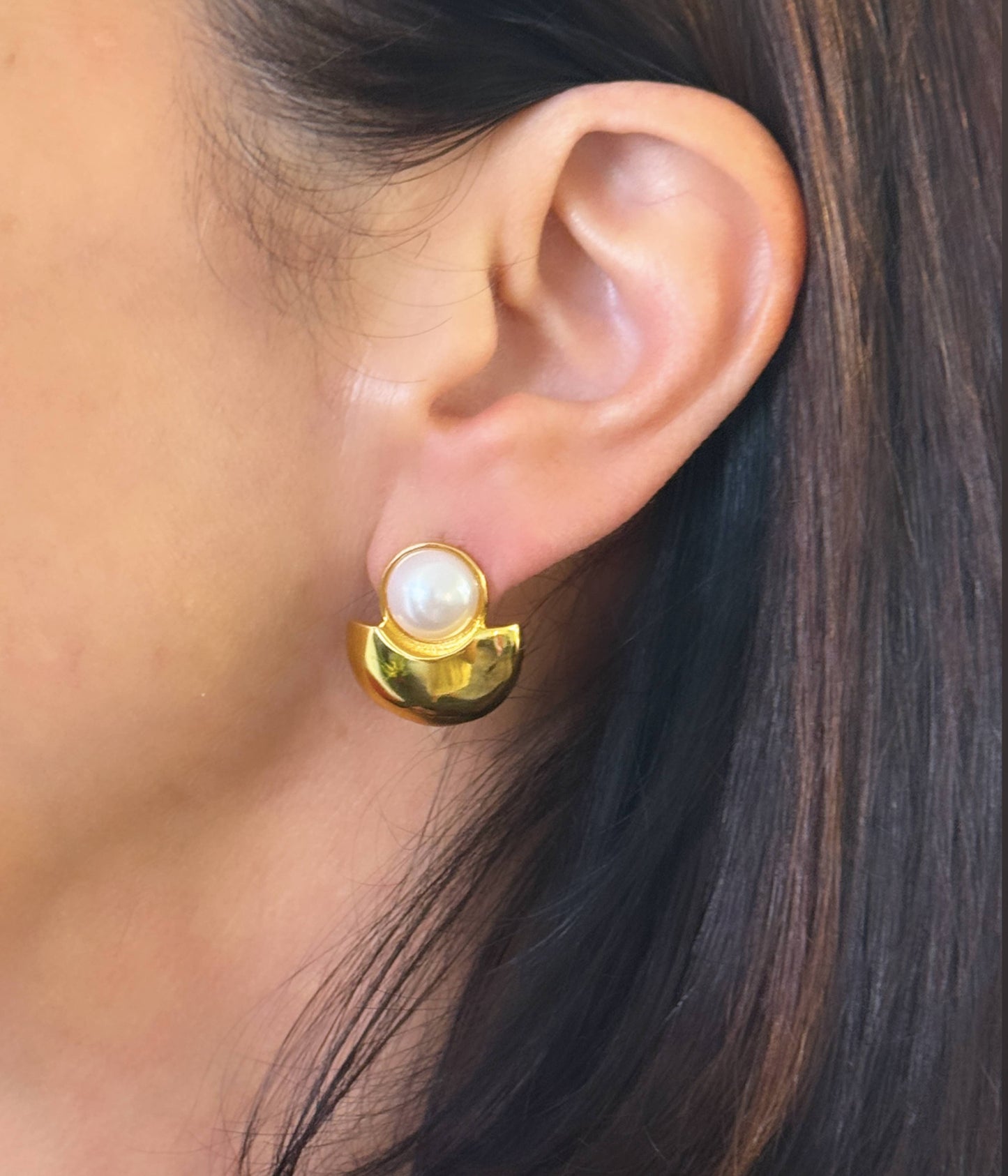 Swanky + sleek The Details Sculpted, modern post earring 2/3” x 2/3” 10mm round cabochon detail Polished 14 karat gold over brass Surgical steel post with large hypoallergenic silicone back