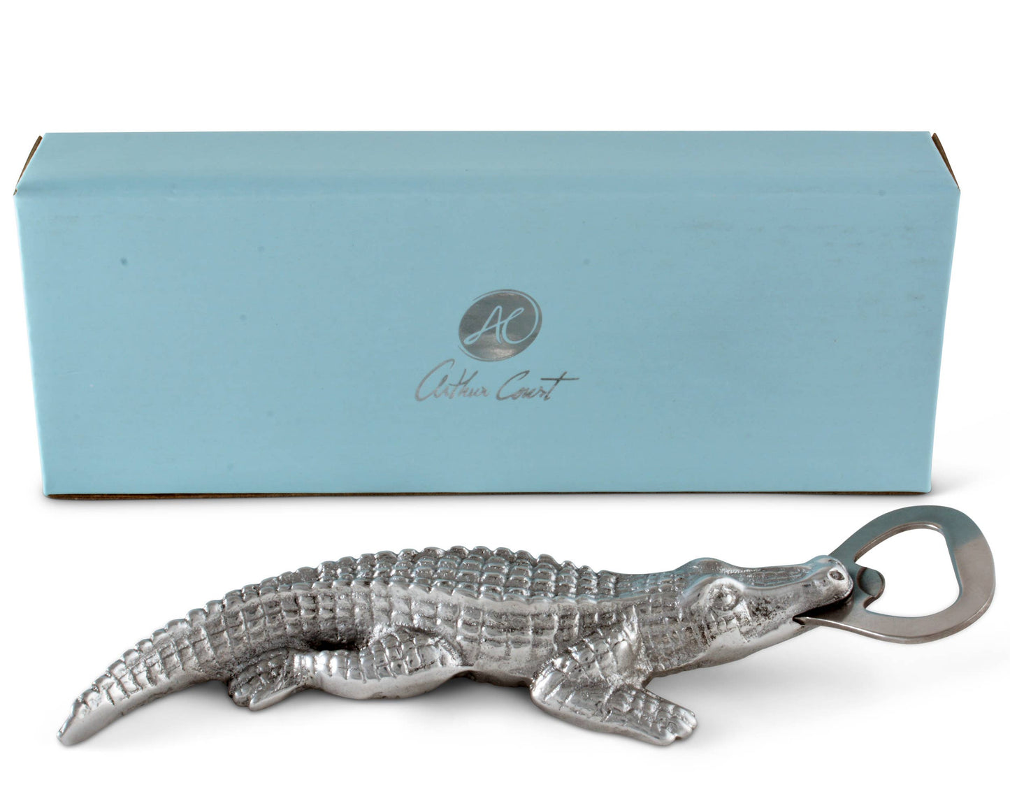 Rip the cap off any beer with this best-selling Alligator Bottle Opener from Arthur Court. Wonderfully detailed in Arthur Court's signature aluminum, this scaly alligator bites down, holding the stainless steel bottle opener with its powerful jaws. The remarkable definition in the creature's hide gives this statuette like opener a rough, naturally appealing texture. Size: L: 7.0" / W: 2.0" Care: Dust with damp cloth. Will not tarnish.